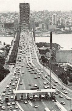 an old black and white photo of traffic on the bay bridge