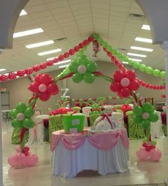 an indoor event with balloons and decorations