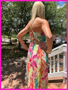 This printed woven midi dress includes a back cut out and tie, a full pleated skirt, and elasticized waist. The cami top features spaghetti straps for a comfortable fit that is adjustable. Details: Fit: true to size Material: 100% Polyester Lining: 100% Polyester Dress Style: Midi length Care: wash on delicate cycle and hang to dry Spring Floral Print Strappy Dress, Strappy Floral Print Spring Dress, Spring Strappy Dresses For A Day Out, Strappy Dresses For Spring Day Out, Spring Day Out Strappy Dresses, Spring Vacation Strappy Midi Dress, Casual Strappy Dress With Floral Print, Spring Brunch Strappy Midi Dress, Spring Strappy Midi Dress For Brunch