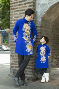 💚 High quality hand-crafted Embroidered Vietnamese Traditional Long Dress for Men, Ao Dai for Groom 💚It's Asian size, it may run out of 1-2 smaller sizes than the International Standard size. Please refer to the size chart before purchasing 💚If you need more information, please let me know! 💚Please provide your chest and waist measurements when placing your order so we can ensure the best fit for you. Please note: Almost all Ao Dai have some sewing Chalk Marks because these are Brand New, un Traditional Embroidered Blue Ao Dai, Embroidered Long Sleeve Fitted Cheongsam, Embroidered Fitted Long Sleeve Cheongsam, Fitted Long Sleeve Embroidered Cheongsam, Ceremonial Embroidered Ao Dai With Long Sleeves, Festive Long Sleeve Embroidered Cheongsam, Men Ao Dai, Traditional Long Dress, The Groom