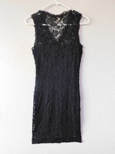 "Vintage black lace dress Sleeveless Lined Great condition Dimension - shoulder 12\" bust 15\" length 35\"" Black Sleeveless Lace Dress With Delicate Details, Sleeveless Lace Dress With Scalloped Lace For Evening, Sleeveless Lace Dress With Lace Patchwork For Evening, Sleeveless Evening Dress With Delicate Lace, Sleeveless Fitted Lace Dress For Evening, Fitted Sleeveless Lace Dress For Evening, Formal Sleeveless Dress With Delicate Lace, Sleeveless Lace Dress For Evening, Sleeveless Lace Dress With Lace Back For Evening