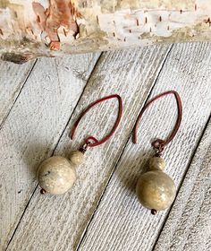 These are 15mm JASPER stones. The ear wires are torched copper that has a unique rose copper finish. Jasper is known for it's grounding effect. Earthy Bronze Jewelry With Ear Wire, Earthy Bronze Earrings With Ear Wire, Brown Teardrop Hoop Earrings With Ear Wire, Rustic Adjustable Copper Earrings, Dangle Jasper Earrings With Ear Wire, Nickel-free Brown Teardrop Earrings For Jewelry Making, Earthy Wire Wrapped Adjustable Earrings, Adjustable Wire Wrapped Brown Earrings, Brown Electroformed Teardrop Jewelry