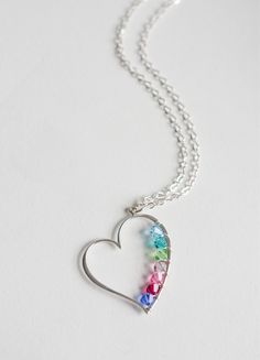 This open heart charm is made of sterling silver and I wire-wrap birthstone color crystals around the inside. <3 Each crystal can represent family, friends or whomever you like. This necklace is a great gift for yourself, mothers(to-be), sisters, etc. Each necklace is going to be completely custom made for you! :) The heart charm fits up to 7 crystals max. Each crystal represents birthstone color and is about 4mm. The pendant is approximately 37mm x 27mm. If you need more than 7 crystals, ple Sterling Silver Heart Birthstone Necklace, Sterling Silver Heart-shaped Birthstone Necklace, Sterling Silver Heart Charm Birthstone Necklace, Sterling Silver Open Heart Birthstone Necklace, Heart-shaped Sterling Silver Birthstone Necklace For Birthday, Mother's Day Sterling Silver Birthstone Necklace With Heart Charm, Personalized Heart Cut Sterling Silver Birthstone Necklace, Sterling Silver Heart Pendant Birthstone Necklace For Mom, Sterling Silver Birthstone Necklace For Mom With Heart Pendant