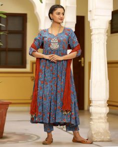 This is a stunning red & blue block printed 3 piece set. It comes with a block-printed kurta with a sweetheart neckline & a set of printed semi-elasticated ankle length palazzo pants and a dupatta to match. Color- Blue & Red Work-Print Work with gota detailing and piping. Suit Fabric-Cotton Dupatta Fabric-Mulmul with beads detailing Sleeves-3/4th sleeves Neck-Round Neck Length-Ankle Length Care-Hand Wash or Dry Clean Blue Cotton Anarkali Set With Traditional Drape, Blue Salwar Kameez With Traditional Patterns For Navratri, Fitted Block Print Anarkali Set For Festivals, Blue Cotton Salwar Kameez With Traditional Patterns, Blue Kalamkari Traditional Wear For Transitional Season, Blue Traditional Wear With Kalamkari Print For Transitional Season, Anarkali Style Red Cotton Palazzo Set, Blue Anarkali Set With Traditional Patterns, Festive Fitted Anarkali Set With Block Print