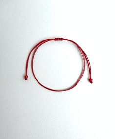 Dark red string ,Red string bracelet, String bracelet, Red string of fate, Minimal bracelet, Lucky bracelet, Good luck bracelet, Simplicity This bracelet is made of two dark red waxed strings and has dark red glass beads at ends. It is adjustable to fit all sizes. *Colours may differ slightly from the original due to the configuration of your computer. *There may be light variations on colour and size. *Items appear larger on your monitor than actual size. Adjustable Red Bracelets For Everyday, Red Adjustable Bracelets For Everyday, Red Waxed Cord Jewelry For Friendship, Red Resizable Friendship Bracelets For Everyday, Red Adjustable Braided Waxed Cord Bracelets, Resizable Red Bracelet For Everyday Wear, Adjustable Red Braided Nylon Cord Bracelet, Adjustable Red Nylon Cord Braided Bracelet, Red Resizable Bracelets