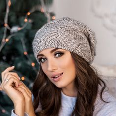 "Warm and cozy alpaca chunky knit gray slouchy beanie hat Trendy chunky knit warm slouchy hat - real decoration of the winter image of a woman. This stunningly beautiful with beautifully twisted around the edge volumetric beret is suitable for any age. This model adding flirty charm to the everyday image. Tam hat reliably warms his head from the cold. Chunky knit. Beret takes a good shape, does not sag. Season: Fall / Winter / Spring Cap length on average 11-11.1/2 \" Unlined Composition: mix al Winter Knit Crochet Hat, Knitted Beanie One Size Fits Most, Slouchy Beanie Bonnet, Winter Knitted Bonnet, Cozy Slouchy Winter Hat, Soft Knit Beanie Hat As Gift, Soft Knit Beanie For Winter Gift, Winter Beanie Hat As Gift, Cable Knit Beanie Hat