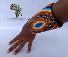 Our Hand Bracelet is a stunning work of art, hand-stitched from fine leather and adorned with exquisite bead art decoration. It's durable, adjustable, and versatile, making it the perfect accessory for any occasion. A symbol of beauty and elegance, it's sure to enhance any outfit and turn heads wherever you go. Don't settle for a boring bracelet - choose the Hand Bracelet and make a bold statement with your fashion choices. Order now and experience the ultimate expression of style, elegance, and individuality. Handmade Multicolor Leather Bracelet With Round Beads, Unique Adjustable Hand-stitched Jewelry, Unique Hand-stitched Adjustable Jewelry, Hand-stitched Adjustable Bohemian Jewelry, Artisan Hand-stitched Adjustable Jewelry, Adjustable Multicolor Leather Bracelet With Colorful Beads, Adjustable Multicolor Wristlet With Wrist Strap, Adjustable Multicolor Leather Beaded Bracelet, Multicolor Leather Beaded Bracelets Handmade