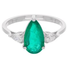 Make a statement with this stunning Gold Diamond Emerald Ring from our collection, designed to add a touch of timeless elegance to your jewelry collection. Crafted from 18k solid white gold, this ring features a dazzling emerald at the center. This ring is available in 10k/14k/18k, Rose Gold/Yellow Gold/White Gold. This is a perfect Gift for Mom, Fiancée, Daughter, Girlfriend, Wife and Grandmother. It can be worn on any occasion. Best Gift for Valentine’s Day, Mother��’s Day, Easter, Christmas, Ne Diamond Emerald Ring, Zambian Emerald, Pear Diamond, Emerald Gemstone, Ring Diamond, Zambia, Nouvel An, Emerald Ring, Diamond Clarity