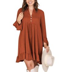 The dress is adorned with a lovely ruffle edge detail, giving it a feminine and playful appeal. Fall Midi Dress With Ruffle Hem For Brunch, Casual Flowy Ruffle Dress For Fall, Beach Midi Dress With Ruffle Hem For Fall, Casual Ruffle Sleeve Mini Dress For Fall, Casual Mini Dress With Ruffle Sleeves For Fall, Fall Vacation Mini Dress With Ruffle Hem, Fall Midi Dress With Ruffles For Day Out, Ruffled Beach Dresses For Fall, Fall Daywear Mini Dress With Ruffle Hem