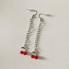 these fun cherry drop earrings are perfect for any occasion! these earrings are handmade from metal and are non-hypoallergenic. keep away from water for best wear and longevity. Cherry Color Dangle Earrings, Cherry Nickel-free Trendy Jewelry, Cherry Color Trendy Nickel-free Jewelry, Trendy Cherry Nickel-free Jewelry, Trendy Handmade Cherry-colored Jewelry, Trendy Cherry-colored Earrings, Trendy Cherry Dangle Earrings, Cherry Dangle Earrings With Ear Wire, Cherry Colored Drop Earrings With Ear Wire