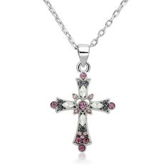 Elegantly crafted from a stainless steel silver metal, this accessory boasts its no-rust, no-fade, and anti-allergenic features. Aside from being a comfortable piece to wear, this silver cross pendant is stunning. Multiple cubic zirconia crystals are embedded all over the pendant, in varying shapes and sizes. The centerpiece is a round pink crystal placed inside a carved out heart. The surrounding crystals are a mix of purples, whites, and other pink shades. This lovely pendant from Innovato Design comes with a silver link chain necklace.  Product Highlights:    Long silver chain necklace (Length: 18")  Lovely Silver Cross Pendant with Crystals  Made from rust-proof and fade-proof stainless steel Chain Link Necklace Silver, Jesus Piece, Purple Cross, Necklace Woman, Christian Necklace, Silver Link Chain, Flower Cross, Crystal Cross, Silver Cross Pendant