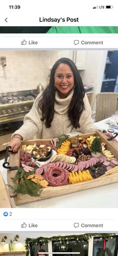 a woman holding a tray full of food