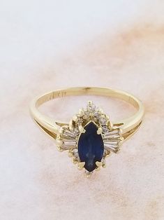 Buy 14k Yellow Gold Sapphire and Diamond Ring Online in India - Etsy Yellow Gold Cluster Sapphire Ring With Center Stone, Yellow Gold Sapphire Cluster Ring With Center Stone, Formal Marquise Cut Gemstone Cluster Ring, Classic 14k Gold Marquise Birthstone Ring, Marquise Cut Birthstone Ring In 14k Gold, 14k Gold Marquise Cut Gemstone Birthstone Ring, 14k Gold Birthstone Ring With Marquise Cut Gemstone, Formal Cluster Yellow Gold Birthstone Ring, Formal Yellow Gold Cluster Birthstone Ring