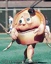 an inflatable character is running on the field