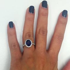 a woman's hand with a ring on it