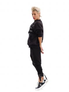 For streetwear lovers who want to add an edgy flair to their casual looks.FEATURES: A double-layered long-sleeved top and tracksuit pants with an elastic waistband. SIZE & FIT: Fit: A relaxed fit with room to move.Model is wearing size Small, or S/M View our SIZE CHART before ordering MATERIALS & CARE: Content: Polyester Care: Machine wash on cold (30ºC) with a mild detergent. Please, have in mind that there are elements in the garment that are not hemmed, on purpose! SHIPPING: Made to order, the processing time is 15 working days This item will be shipped via DHL Trendy Streetwear Sweats With Elastic Cuffs, Trendy Sweats With Elastic Cuffs For Streetwear, Drawstring Sweatpants For Fall Streetwear, Fall Streetwear Sweatpants With Drawstring, Casual Tracksuit With Elastic Cuffs, Casual Tracksuit With Elastic Cuffs And Long Sleeves, Casual Long Sleeve Tracksuit With Elastic Cuffs, Spring Streetwear Long Sleeve Tracksuit, Trendy Sweats With Elastic Cuffs For Leisure