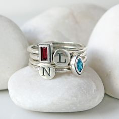 "We just love these stacking birthstone rings in sterling silver. Can be worn by itself or stacked with other rings. Stack your birthstone, or get one birthstone for each child or grandchild! **This listing is for one sterling silver and Swarovski crystal birthstone ring in either cross, heart, marquise, round, square, or rectangle stone setting. These rings stack great with our stackable initial rings!: https://www.etsy.com/listing/214822179 ♥♥ HOW TO ORDER ♥♥ 1. CHOOSE YOUR RING SIZE FROM THE Minimalist Stacked Midi Rings As Gift, Sterling Silver Stackable Initial Promise Ring, Sterling Silver Stackable Rings, May Birthstone Gift, Personalized Sterling Silver Minimalist Birthstone Ring, Anniversary Sterling Silver Stacked Jewelry, Stacked Sterling Silver Jewelry For Anniversary, Anniversary Stacked Sterling Silver Jewelry, Sterling Silver Stacked Jewelry For Anniversary, Silver Stacked Midi Rings As A Gift