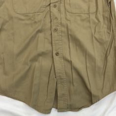 Vintage 1950s-1980s Military Size: medium Measurements: armpit to armpit: 21.5” top to bottom: 32” Khaki Cotton Tops With Snap Buttons, Collared Khaki Top With Snap Buttons, Khaki Collared Cotton Blouse, Khaki Collared Top With Snap Buttons, Khaki Cotton Collared Blouse, Collared Cotton Blouse In Khaki, Vintage Khaki Shirt For Summer, Classic Khaki Tops With Button Closure, Classic Cotton Tops With Snap Buttons