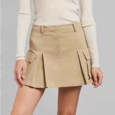 This Skirt Is Brand New With Tags. Chic Skirted Skort With Pockets, Elegant Fitted Cargo Skirt For Spring, Chic Fitted Cargo Skirt With Lining, Chic Fitted Short Cargo Skirt, Fitted Pleated Cargo Skirt For Workwear, Short Length Relaxed Cargo Skirt For Spring, Chic Fitted Mini Cargo Skirt, Spring Mini Length Relaxed Cargo Skirt, Chic Spring Cargo Skirt With Lining