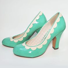 The Varah Heel By B.A.I.T. Footwear Is The Perfect Retro Pump To Wear With Just About Any Outfit! Available In This Beautiful Seafoam Color, It Features A 3 1/4" Heel, Sweet Scalloped Details, And A Shiny Patent Finish. These Fit True To Size, But If You Take A Wider Width We Recommend Sizing Up A Half Size For A More Comfortable Fit. These Cuties Are 100% Vegan Friendly, Too! Only Worn In Store For Try Ons, Otherwise Brand New In Box! Cat Friendly, Non Smoking Home. Green Heels With Contrasting Heel Counter And Round Toe, Green Closed Toe Heels With Contrasting Heel Counter, Retro Heels With Heel Tab And Round Toe, Retro Heels With Contrasting Heel Counter And Round Toe, Retro Round Toe Heels For Wedding, Green Court Shoes With Sculpted Heel And Round Toe, White High Heel With Heel Tab, Green Round Toe Wedding Shoes, Wedding Shoes With Sculpted Heel And Round Toe