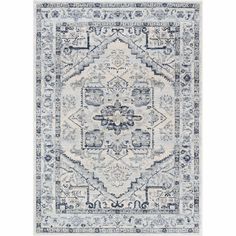 a blue and white rug with an ornate design on the bottom, in front of a white background