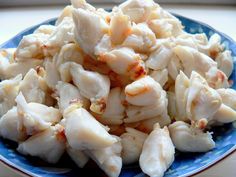 a blue plate topped with chicken and rice