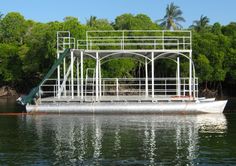 a houseboat is sitting in the water