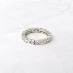 Beautiful eternity style diamond band featuring 3mm stone diamonds. It is elegant and chic and great for stacking or as a wedding band! Made of 925 Sterling Silver We use a THICK, DURABLE plating of 14K Gold, Rose Gold or Rhodium - for a piece that will last you years to come! Highest grade CZ for an authentic diamond look! Nickel-free & Hypoallergenic Thickness: 3mm Ring Sizer Moissanite Eternity Band With Vs Clarity For Anniversary, Eternity Band With Vs Clarity Diamonds For Anniversary, Round Vs Clarity Eternity Band For Anniversary, White Eternity Band With Vs Clarity, Luxury Stackable Round Eternity Band, White Vs Clarity Round Eternity Band, Diamond Accents Eternity Band For Anniversary, Cubic Zirconia Eternity Band With Prong Setting For Anniversary, Anniversary Eternity Band With Prong Setting In Cubic Zirconia