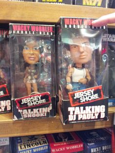 three talking heads are on display in a store