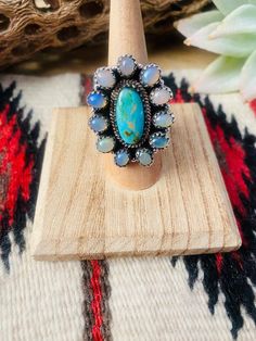 New without tags* JEWELRY TYPE : Ring * METAL : Sterling Silver * MAIN STONE : Opal  This is a beautiful handmade Turquoise, Opal and Sterling Silver Adjustable Cluster Ring. Ring measures 1 3/8 inches long and 1 1/8 inches wide. Stamped Sterling and Nizhoni. So beautiful!   **Non-Native**  Thank you for checking out our store. Please let us know if you have any questions.  2/12/23    Exported By ExportYourStore :) SKU:436783178385_B4E7* Native American Necklace, Bouquet Charms, Turquoise Earrings Dangle, Bridesmaid Gifts Jewelry, Stack Ring, Ring Metal, Body Jewellery, Bridesmaids Gifts, Handmade Sterling Silver