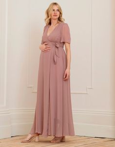 Soft, flattering & utterly feminine, Seraphine's Mauve Maxi Maternity & Nursing Wrap Dress is a stunning style for special occasions - we love it for weddings. Affordable Fitted Maternity Maxi Dress, Long Sleeve Maternity Dress Amazon, Elegant Fitted V-neck Maternity Dress, Chic Empire Waist Bridesmaid Dress, Elegant Floor-length Maternity Dress For Wedding, Chic Bridesmaid Dress With Empire Waist, Elegant V-neck Maternity Gown, Flowy Empire Waist Bridesmaid Dress, Elegant Flowy Empire Waist Dresses