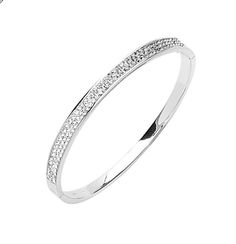 Strike sparkle and shine on wearing this glamorous Two Row Simulated Diamond CZ Oval Bangle Bracelet in Sterling Silver. It is beautifully crafted in sterling silver and is ideal to build an elegant look on when worn either standalone or as a stack piece around your wrist. This bangle bracelet is hypoallergenic and nickel free in nature. It is also well secured by a box clasp that offers safety and comfort when worn. The bangle is extremely elegant as it is only 3mm thick and 7.5 inches in circu Oval Bangle, Crochet Mat, Box Clasp, Shine On, Sparkle And Shine, Elegant Look, Look On, Bangle Bracelet, The Row