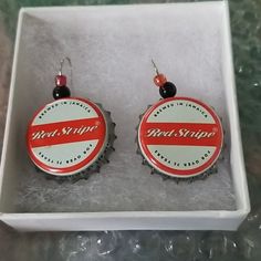 Hand Made Bottle Cap Earrings Brewed In Jamaica For Over 75 Years With Black Pearl And Red Bead. Red Stripe. Gift Red Beaded Earrings With Bead Caps, Handmade Red Casual Earrings, Handmade Casual Red Earrings, Red Round Earrings For Beach, Casual Red Nickel-free Earrings, Bottle Cap Earrings Diy, Red Beaded Earrings With Black Round Beads, Red Round Beach Earrings, Black And Red Beaded Earrings