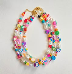 Unique and funky necklace made with all sorts of high quality beads Looks adorable on the neck and is so colorful🦋 It is made on beading wire.  Comes in variations of this same basic design. No two are the exact same, all are unique 🌟Buy today! There are three options, gold filled, stainless steel, and silver links and clasp. Prices vary for each. The gold stainless steel is not recommended to be worn in the water. Cheap Colorful Playful Necklaces, Playful Cheap Colorful Beaded Necklaces, Handmade Fun Necklaces For Summer, Fun Round Bead Necklaces For Summer, Playful Beaded Necklaces For The Beach, Fun Summer Necklaces With Round Beads, Handmade Playful Summer Necklaces, Playful Festival Jewelry With Colorful Beads, Whimsical Multicolor Beaded Necklaces