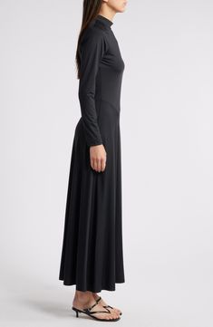 Asymmetric seams lend modern style to this versatile maxi dress boasting sumptuous stretch for event-ready comfort. 54 1/2" length (size Medium) Back keyhole with button-and-loop closure Mock neck Long sleeves Unlined 87% nylon, 13% spandex Dry clean Imported Fitted Sleek Maxi Dress, Sleek Fitted Maxi Dress, Sleek Full-length Bias-cut Maxi Dress, Sleek Fitted Maxi Dress In Elastane, Sleek Fitted Maxi Dress Made Of Elastane, Asymmetrical Fitted Maxi Dress For Evening, Sleek Stretch Maxi Dress With Flattering Silhouette, Fitted Maxi Dress With Side Slits For Work, Formal Long Maxi Dress With Side Slits