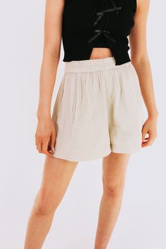 Unleash those legs in FREE PEOPLE's Get Free Poplin Pull On Shorts! With an elastic waist, these shorts are perfect for a comfortable and playful summer look. Say goodbye to restrictive waistbands and hello to effortless style! Details Elastic waist Sizing Approximate measurements: SIZE LENGTH/INSEAM WAIST XSmall 14/13" 27" Small 15/14"﻿ 30"﻿ Medium 15.5/15"﻿ 32"﻿ Large 16/15.5"﻿ 33"﻿ XLarge 17/16" 34" Fabric has stretch in the waistbandModel is 5’10 wearing small Material 62% Cotton 32% Viscose Vacation Paperbag Waist Shorts With Elastic Waistband, Vacation Paperbag Waist Shorts With Elastic Band, Vacation Shorts With Elastic Paperbag Waist, Warm Weather Bottoms With Built-in Shorts, Chic Relaxed Fit Shorts With Elastic Waistband, High-waisted Shorts With Elastic Waistband For Day Out, Beige Relaxed Fit Shorts With Elastic Waistband, Trendy Bermuda Shorts With Elastic Waistband For Summer, Elastic High-waisted Shorts For Day Out