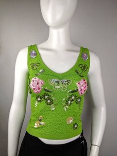 "Vintage Roccobarocco bright green tan top, ribbed stretchy cotton, front is embroidered with beads and sequins, rhinestones brand logo on the back. Size USA4 FR34 tag, fits XS-S (see the measurements) Condition 9/10 (good condition) Made in Italy Underarm to underarm - cm/\" Strapless front length - cm/\" All measurements taken with garment lying flat. Vintage sizes vary greatly! We recommend comparing measurements with a similar style garment you own for best fit! If you have any other questio Luxury Green Sleeveless Tops, Green V-neck Y2k Tops, Spring Embellished V-neck Tank Top, Fitted Sequined Tank Top For Summer, Spring Sequined Stretch Tank Top, Stretch Sequined Tank Top For Spring, Green Y2k Summer Tops, Green Summer Y2k Tops, Green Y2k Style Summer Top