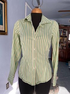 "Vintage mens' style shirt for woman, great fit spandex 3%, cotton 97% washable. please look at the princess cut style, very flattering! US Size M please check measurements below: SHOULDERS: 14.5\" BUST: 36\" WAIST: 29-31\" SLEEVES LENGHT: 23. 3/4\" LENGHT: 24\" FINAL SALE, NO RETURNS, NO EXCHANGES PLEASE CONTACT FOR ANY QUESTIONS OR CONCERNS." Green Stretch Long Sleeve Shirt, Green Cotton Shirt With Striped Collar, Spring Green Shirt With Vertical Stripes, Green Vertical Stripes Shirt For Spring, Vertical Striped Fitted Tops, Green Long Sleeve Shirt With Striped Collar, Fitted Long Sleeve Shirt With Vertical Stripes, Fitted Shirt With Striped Collar For Spring, Classic Green Stretch Top