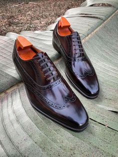 Elevate your formal attire with these timeless Brown Wingtip Oxford Shoes. Meticulously crafted from premium leather, these shoes feature a classic brogue design with intricate perforations, adding a touch of sophistication to any ensemble. The closed lacing system and polished finish ensure a refined look, perfect for business meetings, special occasions, or any event where you want to make a lasting impression. Timeless Wingtip Oxfords For Formal Occasions, Luxury Wingtip Lace-up Business Shoes, Luxury Wingtip Lace-up Shoes For Business, Timeless Formal Wingtip Oxfords, Luxury Wingtip Lace-up Shoes For Galas, Wingtip Lace-up Shoes With Brogue Detailing For Galas, Gala Wingtip Lace-up Shoes With Brogue Detailing, Timeless Wingtip Dress Shoes For Galas, Formal Wingtip Oxfords With Rubber Sole