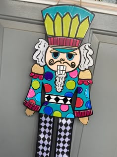 a door hanger that has a colorful figure on it