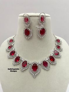 American Diamond Necklace Set / CZ Necklace/Indian Jewelry/ Reception Jewelry/ Bollywood Jewelry/ Silver Red  All items are shipped from Brampton, Ontario, Canada. If you need your item by a certain day, please reach out to us for express delivery option before placing the order so that we can update the shipping for you. Standard shipping/delivery timeline Below are the delivery timeline estimates. We dispatch all orders by the next business day. ---> USA delivery timeline * 3-6 business days to major urban centers in USA. It may take days extra to remote locations ---> Canada delivery timeline  * 2-3 business days - GTA  & Montreal  * 2-4  business days - Rest of Ontario/Quebec * 3-6 business days-  Rest of Canada    ---> Europe/Middle East timeline * 5-10 business days We kindly request Classic Red Ruby Jewelry, Silver Jewelry Sets With Stones For Formal Occasions, Formal Silver Jewelry Sets With Stones, Red Sterling Silver Jewelry Sets For Party, Red Cubic Zirconia Jewelry Sets For Celebration, Round Ruby Necklace For Party, Party Ruby Necklace In White Gold, White Gold Ruby Necklace For Party, Red Sterling Silver Party Jewelry Sets