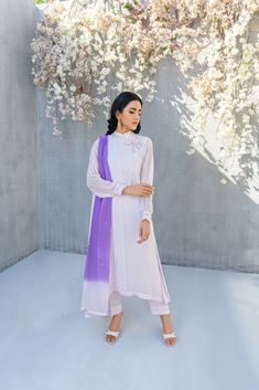 SKU: 2201 Price for Shirt, lining & Pants This immaculately crafted lilac pleated ensemble is all set to make its way to our festive wardrobe. Adorned with glistening pearls, thread, and hand embellished with crystals. This ensemble comes up with a gorgeous double shaded duppatta to complete the look. Dupatta as is can be added to complete this serene outfit. Purple Silk Party Sets, Purple Silk Sets For Formal Occasions, Elegant Lavender Festive Sets, Elegant Lavender Sets For Festive Occasions, Elegant Festive Lavender Sets, Festive Lavender Long Sleeve Set, Elegant Lavender Party Sets, Spring Wedding Purple Sets, Purple Wedding Sets For Spring