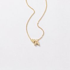 Dainty ♥ initial necklace - a meaningful piece of jewelry that is simple and stylish. D E T A I L S * Single initial size is approximately 5 x 7 mm * Chain is 14k gold fill, sterling silver, or 14k rose gold fill OR 14k gold plate, silver plate, or 14k rose gold plate * Charms are matte gold plate, matte silver plate, or shiny rose gold plate * This listing is for one necklace with two charms P R O M O T I O N * Bridesmaids gifts: message us for a coupon code * New FACEBOOK or INSTAGRAM follower Mother's Day Heart Necklace With Adjustable Initial Pendant, Dainty Personalized Initial Heart Necklace, Dainty Personalized Heart Necklace With Initial, Dainty Personalized Heart Necklace With Initial Pendant, Initials Pendant Necklace For Mother's Day, Dainty Initial Pendant Charm Necklace For Valentine's Day, Valentine's Day Initial Pendant Necklace With Adjustable Chain, Dainty Initial Pendant Necklace For Valentine's Day, Dainty Valentine's Day Charm Necklace With Initial Pendant