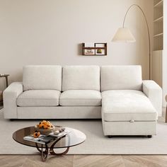 a living room with a white couch and coffee table