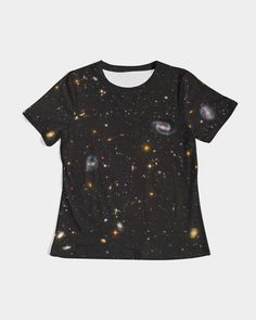 a black t - shirt with an image of the galaxy and stars on it's chest