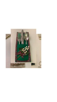 an assortment of utensils and spoons are laid out on a table cloth