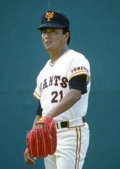 a baseball player holding a catchers mitt