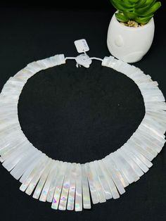 One Piece white Mother of pearl beaded necklace,  Beads Necklace. Handmade/Hand Braided Necklace Necklace length: 20.7 Inches Materials: White Mother of Pearl Adjustable length: No Can be personalized: Yes We take order work as well. Feel free to contact for purchasing goods in bulk. We are Wholesaler & manufacturers of semi-precious & precious gemstones, Loose Gemstones Beads, Cabochons. Measurements & weight are close approximations Handmade White Pearl Shell Necklace, White Shell-shaped Pearl Drop Necklace, White Necklaces With Colorful Beads For Party, White Round Beads Shell Necklace Gift, White Round Beads Shell Necklace As Gift, White Shell Necklace With Round Beads For Gift, White Beaded Shell Pearl Necklace, White Pearl Jewelry With Faceted Beads, White Pearl Necklace With Gemstone Beads As A Gift