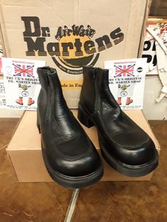 These are a model of Dr MARTENS that were made in the heyday of the 1990s. They were made at their original factory in Northampton,  England.   These boots were only made for a couple of seasons, so were rare even back then.  The boot is finished in black leather and has two zips for ease of use. They are ankle length and have a black so,e unit with a heel. These are a uk size 4 European 37 ladies USA 6 Northampton England, Dr Martens Shoes, Martens Shoes, The 1990s, Hunter Boots, Beautiful Shoes, Dr. Martens, Boot Shoes Women, New Shoes