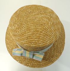 -Description- >boy's straw hat with striped bow ribbon >ribbon is blue, pink, green, yellow >cute hat! >condition: great >color(s): tan, blue, green, pink, yellow >fabric(s): straw >size: one size fits most -social media- instagram: @voguevibesvintage H#1 VVV0380 Retro Wide Brim Beach Hat, Retro Wide Brim Fedora For Beach, Retro Flat Brim Sun Hat For Beach, Retro Short Brim Hat For Vacation, Adjustable Brimmed Retro Boater Hat, Retro Adjustable Brimmed Boater Hat, Retro Flat Brim Beach Hat, Casual Top Hat With Flat Brim For Beach, Retro Short Brim Bucket Hat For Beach